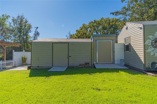 view of outdoor structure with a yard