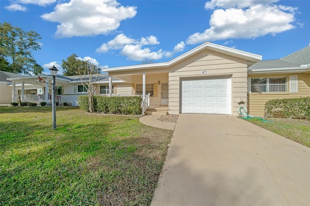 ranch-style home with a garage, a porch, and a front lawn