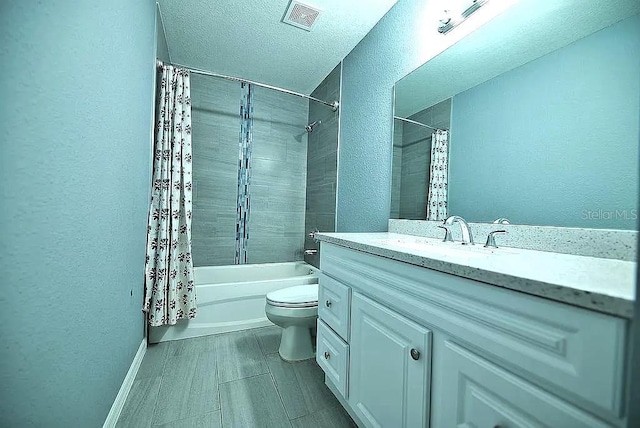 full bathroom featuring a textured ceiling, toilet, shower / bath combination with curtain, and vanity