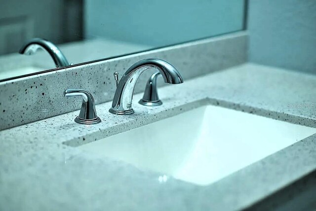 room details with decorative backsplash and sink