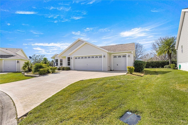 view of front facade with a garage and a front lawn