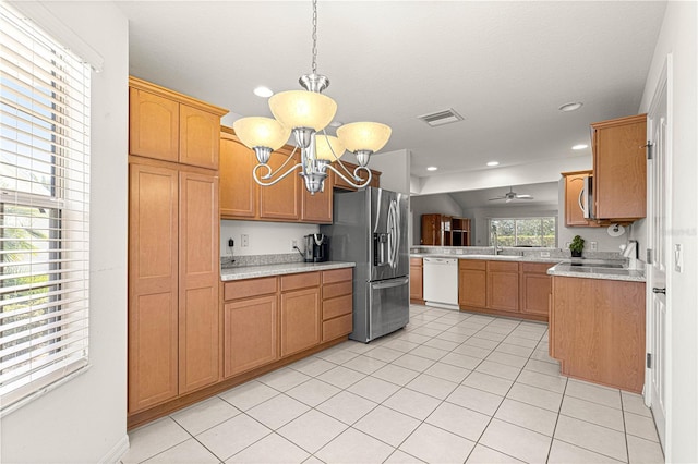 kitchen featuring ceiling fan with notable chandelier, decorative light fixtures, light tile patterned floors, white dishwasher, and stainless steel fridge with ice dispenser