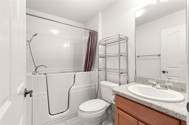 full bathroom with vanity, shower / bath combination with curtain, toilet, and a textured ceiling