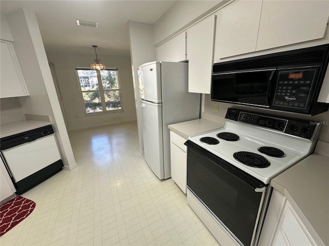 kitchen featuring white cabinetry, hanging light fixtures, and white appliances