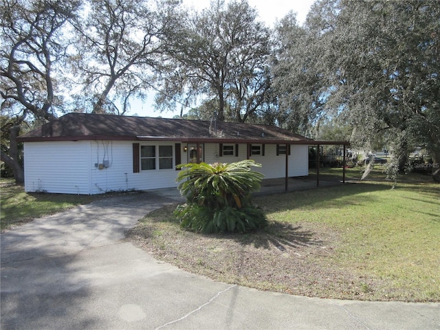 single story home featuring a carport and a front yard