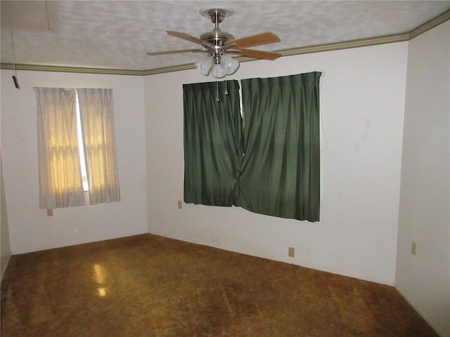 unfurnished room featuring ceiling fan, a textured ceiling, and ornamental molding