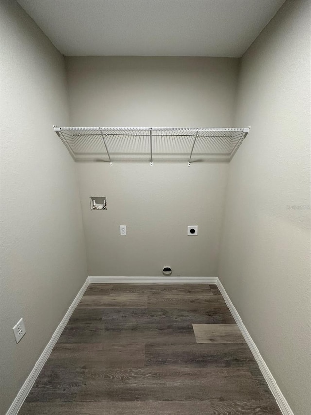 clothes washing area featuring washer hookup, dark hardwood / wood-style flooring, and hookup for an electric dryer