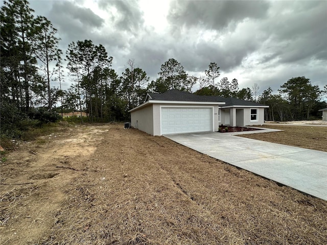 ranch-style house featuring a garage