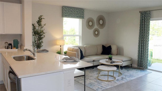 tiled living room featuring sink