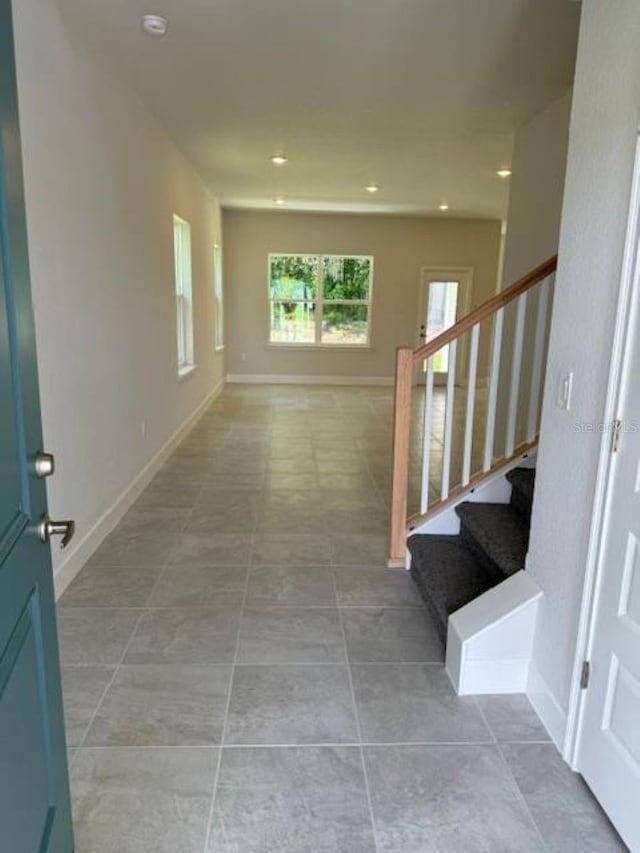 2214 NW 23rd Loop, Ocala, FL 34475 - corridor with stairs, light tile patterned floors, and recessed lighting