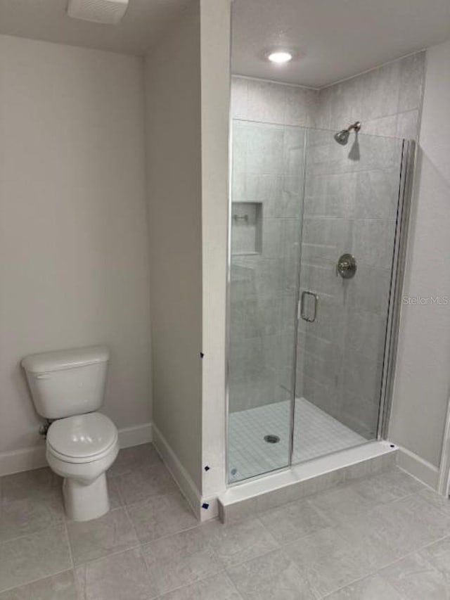 2214 NW 23rd Loop, Ocala, FL 34475 - bathroom with a shower stall and tile patterned flooring