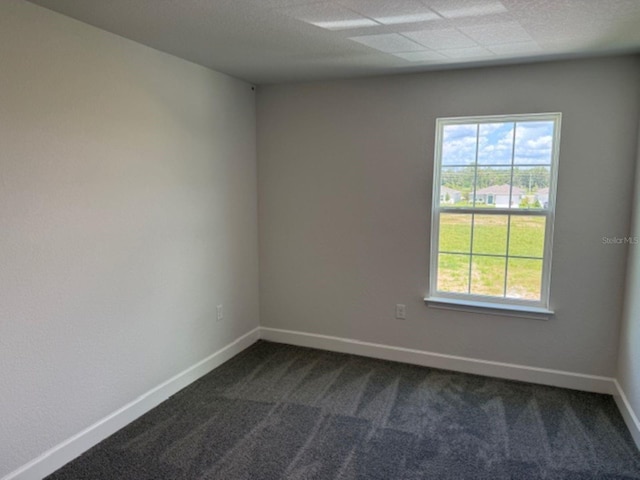 2214 NW 23rd Loop, Ocala, FL 34475 - spare room with dark colored carpet