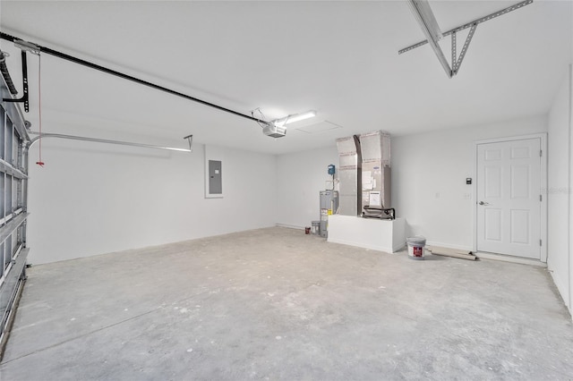 garage featuring heating unit, a garage door opener, and electric panel