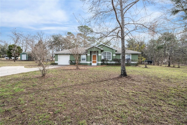 ranch-style house featuring a front lawn and a garage