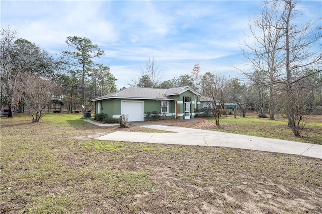 ranch-style house with a front yard, central air condition unit, and a garage