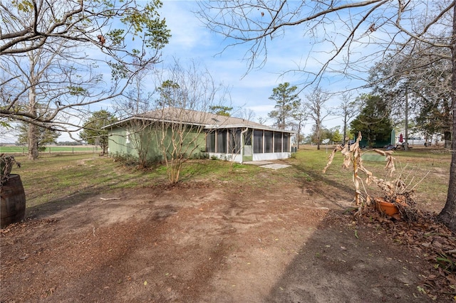 rear view of house with a sunroom