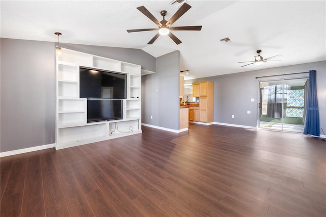 unfurnished living room with a textured ceiling, ceiling fan, dark hardwood / wood-style flooring, and lofted ceiling