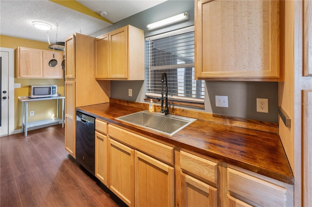 kitchen featuring butcher block countertops, black dishwasher, light brown cabinets, dark wood-type flooring, and sink