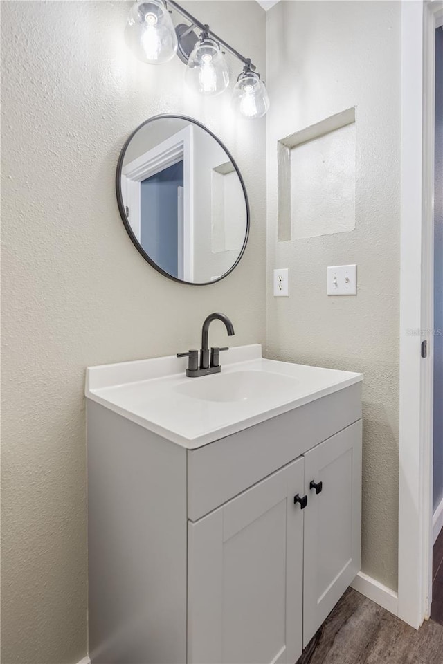 bathroom featuring hardwood / wood-style floors and vanity