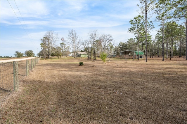 view of yard with a rural view