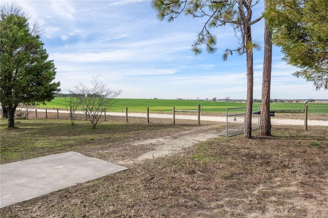 view of yard with a rural view