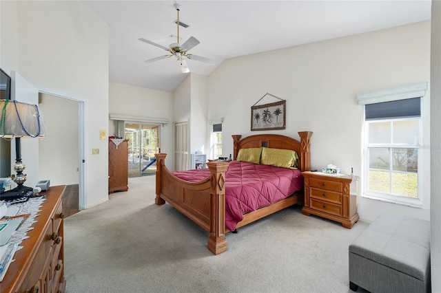 carpeted bedroom featuring vaulted ceiling and ceiling fan