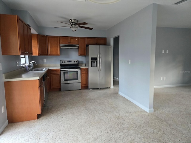 kitchen featuring ceiling fan, stainless steel appliances, and sink