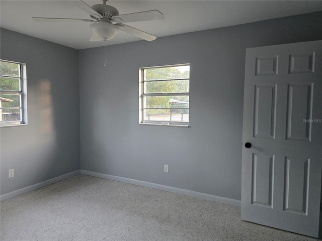 unfurnished room featuring ceiling fan