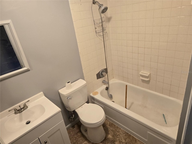 full bathroom featuring toilet, tiled shower / bath, and vanity