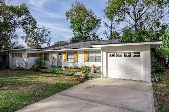 ranch-style house with a front lawn and a garage