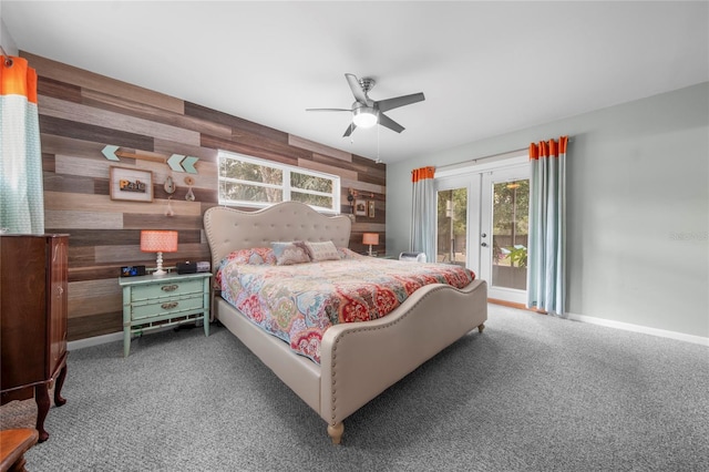 bedroom featuring carpet floors, french doors, access to exterior, wood walls, and ceiling fan