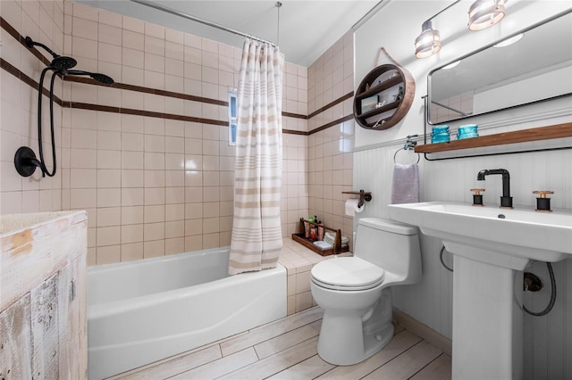 bathroom with toilet, wood-type flooring, and shower / tub combo with curtain