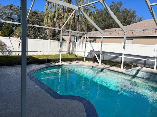 view of pool with a lanai