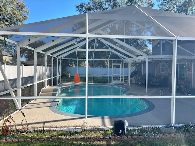 view of pool featuring a lanai and a patio