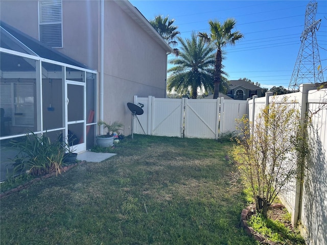 view of yard with a sunroom