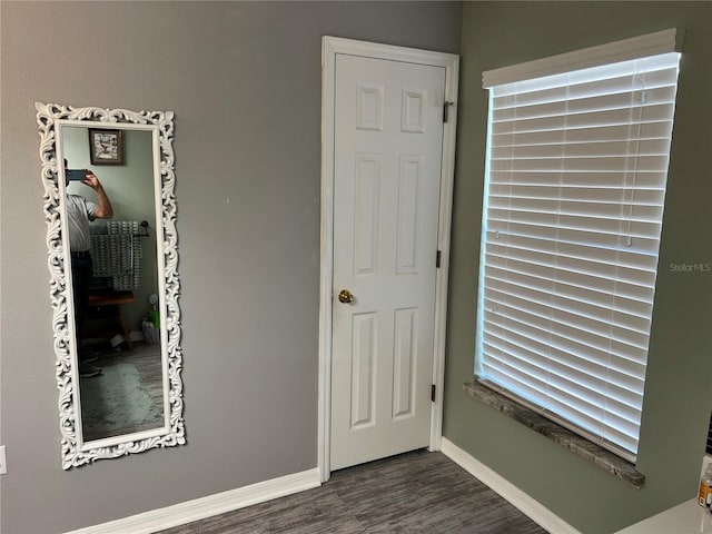 unfurnished bedroom featuring dark wood-type flooring