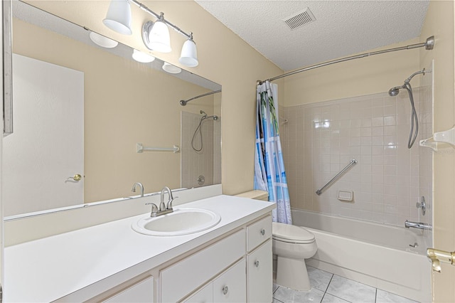 full bathroom featuring toilet, shower / bath combo, tile patterned flooring, a textured ceiling, and vanity