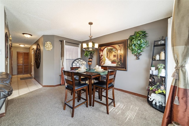 carpeted dining area with a textured ceiling and an inviting chandelier