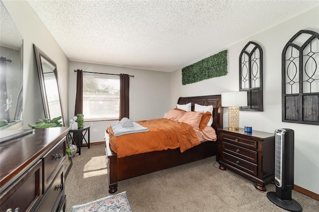 bedroom featuring light colored carpet and a textured ceiling