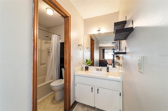 full bathroom featuring toilet, vanity, shower / bath combo with shower curtain, and a textured ceiling