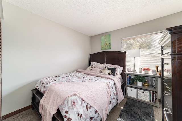 carpeted bedroom with a textured ceiling