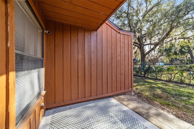 view of gate with a patio