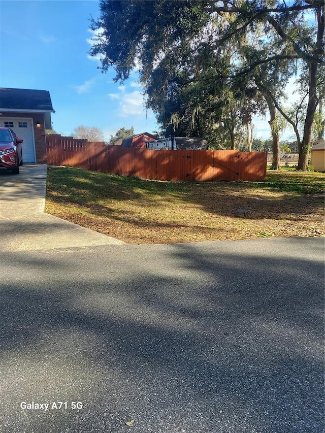 view of yard featuring a garage