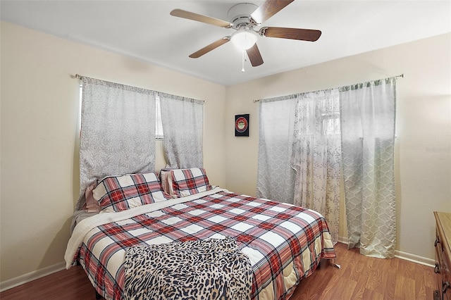 bedroom featuring ceiling fan and hardwood / wood-style flooring