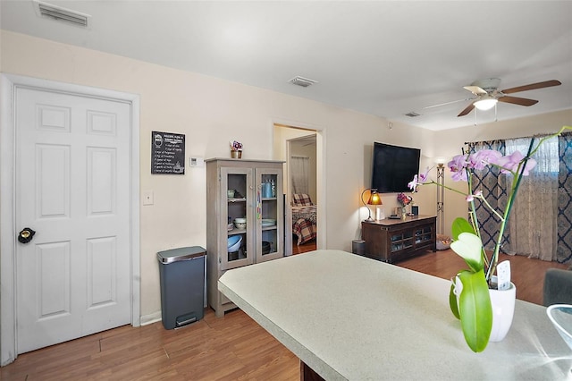 bedroom with ceiling fan and hardwood / wood-style flooring