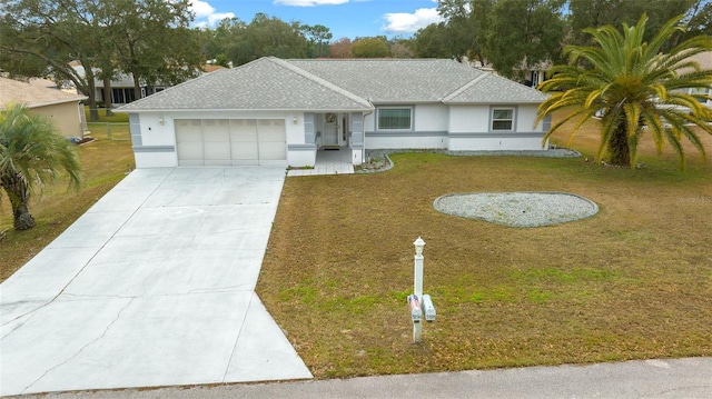 ranch-style house featuring a front lawn and a garage