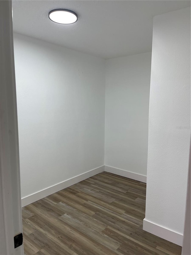 spare room featuring dark hardwood / wood-style flooring