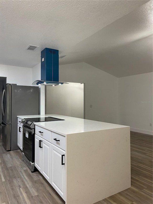 kitchen with island range hood, white cabinetry, lofted ceiling, wood-type flooring, and black range with electric cooktop