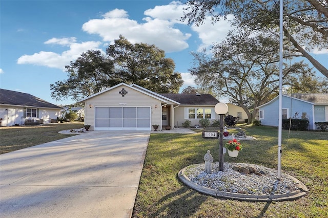 single story home featuring a garage and a front yard