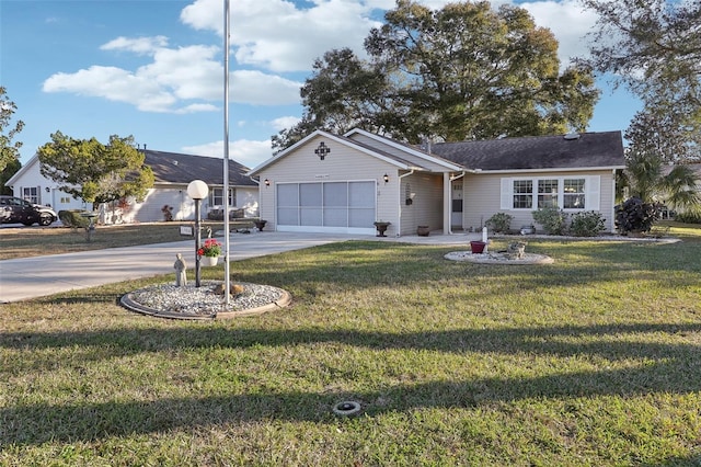 ranch-style house featuring concrete driveway, a garage, and a front lawn